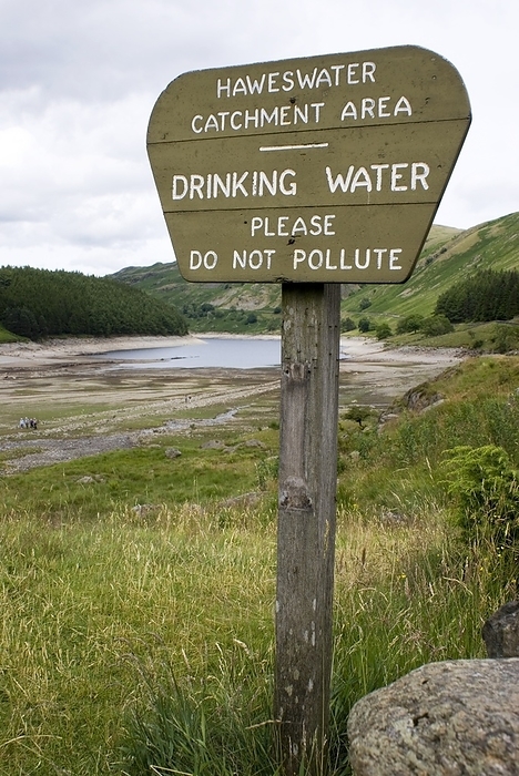 Haweswater reservoir sign 2010 drought A sign at the Mardale Head end  southern extent  of Haweswater reservoir, Cumbria, UK, indicating the Haweswater Catchment Area and warning that the reservoir contains drinking water which should not be polluted. Photographed during the drought of summer 2010  under normal conditions the entire valley would be flooded up to the vegetation line at the top of the beach. The village of Mardale was drowned to make the reservoir., Photo by MARK WILLIAMSON SCIENCE PHOTO LIBRARY