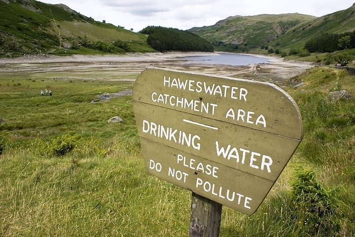 Haweswater reservoir sign 2010 drought A sign at the Mardale Head end  southern extent  of Haweswater reservoir, Cumbria, UK, indicating the Haweswater Catchment Area and warning that the reservoir contains drinking water which should not be polluted. Photographed during the drought of summer 2010  under normal conditions the entire valley would be flooded up to the vegetation line at the top of the beach. The village of Mardale was drowned to make the reservoir., Photo by MARK WILLIAMSON SCIENCE PHOTO LIBRARY