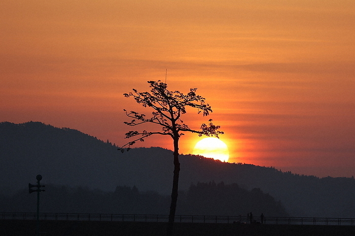 The sunrise in Rikuzentakata City, where the  Miracle Pine Tree  still remains. The morning sun rises over Rikuzentakata City, where the  Miracle Pine Tree  remains, on the morning of March 11, 2022 in Rikuzentakata City, Iwate Prefecture. 5:58 a.m., photo by Daisuke Wada