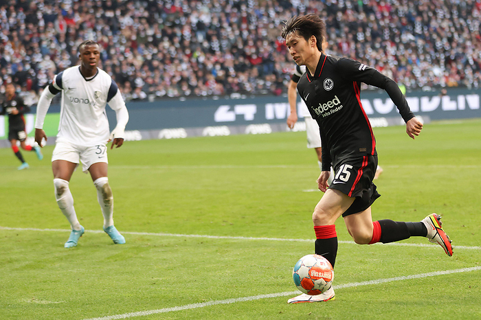 Eintracht Frankfurt   VfL Bochum, 1. FBL Daichi Kamada  Eintracht Frankfurt, 15  gegen Armel Bella Kotchap  VfL Bochum,     Eintracht Frankfurt VfL Bochum, 1 FBL Daichi Kamada Eintracht Frankfurt, 15 against Armel Bella Kotchap VfL Bochum, 37 Bundesliga match between Eintracht Frankfurt and VfL Bochum on 13 March 2022 at Deutsche Bank Park in Frankfurt am Main According to the requirements of the DFL, Deutsche Fu ball Liga, it is prohibited to exploit or have exploited photographs taken in the stadium and or from the game in the form of sequence pictures and or video like photo series , Frankfurt am Main Hesse Germany Deutsche Bank Park