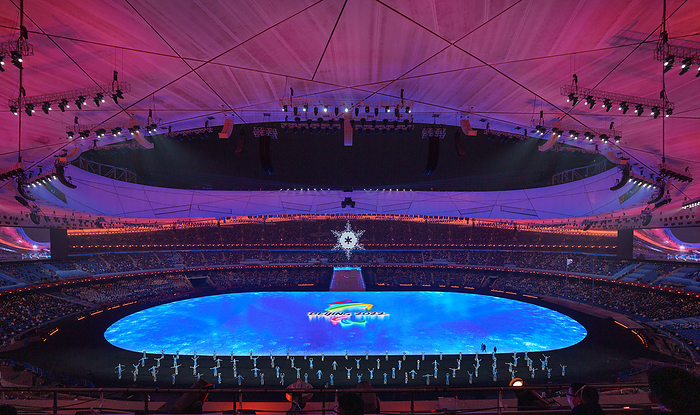 Beijing 2022 Paralympics Closing Ceremony  Courtesy photo  General view of the stadium with performers on the stage and the Beijing 2022 logo, at the beginning of the Closing Ceremony at the National Stadium. Beijing 2022 Winter Paralympic Games, Beijing, China, Sunday 13 March 2022. Photo: OIS Bob Martin. Handout image supplied by OIS IOC  COPYRIGHT OF OLYMPIC INFORMATION SERVICES. COMMERCIAL USE IS PROHIBITED.