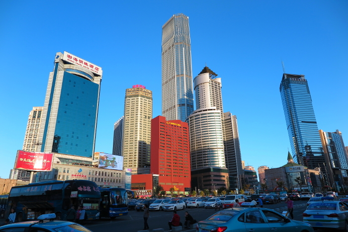 Skyscrapers in front of the station as seen from the south exit of Dalian Station (China)