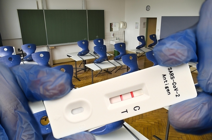 PHOTOMONTAGE, positive antigen rapid test, empty classroom, fear of fourth wave, Corona crisis, Germany, Europe, Photo by Michael Weber