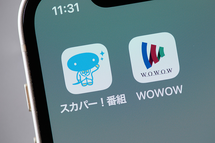 smartphone app The logos of mobile apps SKY PerfecTV  and WOWOW, are displayed on a screen in Tokyo, Japan, February 16, 2022.  Photo by Shingo Tosha AFLO 