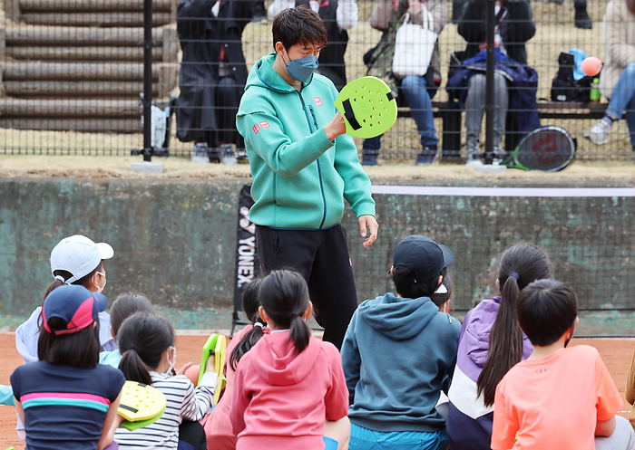 Completed the first outdoor red clay court in Japan March 26, 2022, Tokyo, Japan   Japan s tennis star Kei Nishikori plays with elementary school children after he attended the opening ceremony of the red clay tennis courts which use surface soil of France s Roland Garros stadium in Tokyo on Saturday, March 26, 2022. Japan s Dai ichi Life Insurance company remodeled the company s tennis courts to Japan s first outdoor red clay courts as a part of Japan Tennis Association s training program for the young tennis players.    Photo by Yoshio Tsunoda AFLO  