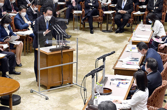 National Diet of Japan, House of Councillors, Committee on Accounts Prime Minister Fumio Kishida  back left  answers questions from Fumika Shiomura  front right  of the Constitutional Democratic Party of Japan  DPJ  at the Upper House Committee on Financial Statements, 11:44 a.m., March 28, 2022 in the Diet.