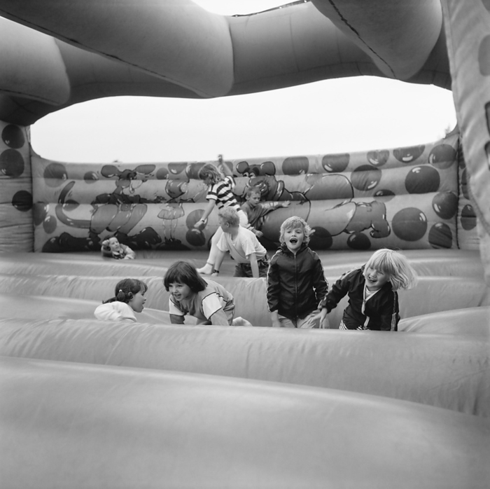 Laing Sports Ground, Rowley Lane, Elstree, Barnet, London, 11 06 1988. Creator: John Laing plc. Laing Sports Ground, Rowley Lane, Elstree, Barnet, London, 11 06 1988. Children playing on the bouncy castle at the 1988 Family Day at Laing s Sports Ground. Attractions at that year s Family Day included  a parade of vintage cars, helicopter rides, plate smashing, stalls, an  It s a Knockout  style competition and tennis and six a side football tournaments.  The event was opened by John Conteh, former world light heavy weight champion and ended with a barbecue and disco.