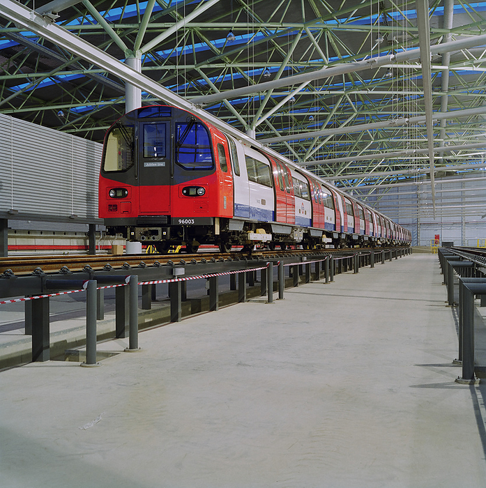 Stratford Market Depot, Stratford, Newham, London, 11 12 1996. Creator: John Laing plc. Stratford Market Depot, Stratford, Newham, London, 11 12 1996. One of the new Jubilee Line underground tube trains  96003 , standing on the tracks of one of the eleven maintenance bays inside the main shed at Stratford Market Depot. Construction on the Stratford Market Depot was carried out by Laing London, with work starting on the 35 acre site in November 1993. The train depot, designed by architects Wilkinson Eyre, was built as part of the Jubilee Line Extension running from Green Park to Stratford and was where trains would be maintained and serviced. The shed which is a skewed parallelogram shaped structure, measuring 100m x 190m, had the space capacity to accommodate almost half the fleet, including 59 new six car trains, with the first of the new trains arriving at the shed on 11th December 1996.