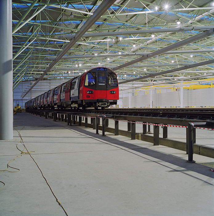 Stratford Market Depot, Stratford, Newham, London, 11 12 1996. Creator: John Laing plc. Stratford Market Depot, Stratford, Newham, London, 11 12 1996. One of the new Jubilee Line underground tube trains  96003 , standing on the tracks of one of the eleven maintenance bays inside the main shed at Stratford Market Depot. Construction on the Stratford Market Depot was carried out by Laing London, with work starting on the 35 acre site in November 1993. The train depot, designed by architects Wilkinson Eyre, was built as part of the Jubilee Line Extension running from Green Park to Stratford and was where trains would be maintained and serviced. The shed which is a skewed parallelogram shaped structure, measuring 100m x 190m, had the space capacity to accommodate almost half the fleet, including 59 new six car trains, with the first of the new trains arriving at the shed on 11th December 1996.