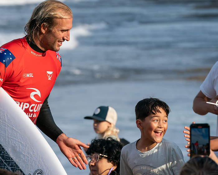 2022 Rip Curl Pro Bells Beach Mens CT BELLS BEACH, AUS 16 APRIL 2022: Owen Wright from Australia signing autographs with excited young fans following his defeat in the quarter finals to Ethan Ewing from Australia at the WSL Rip Curl Pro Bells Beach. 
