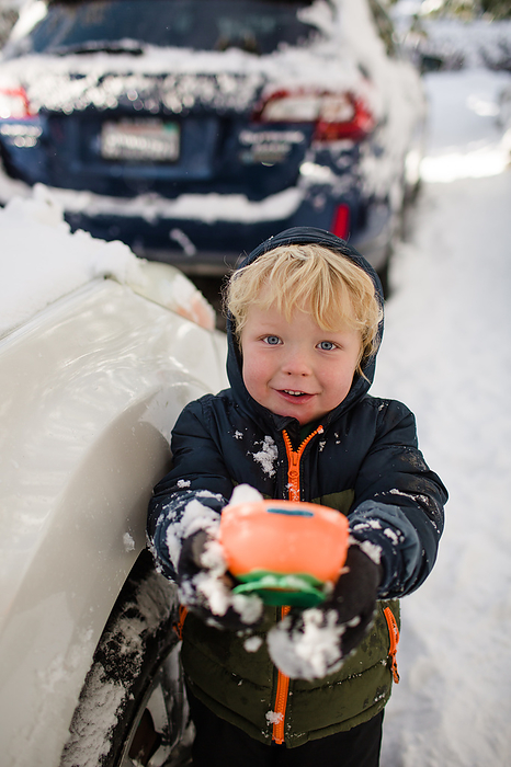 Three Year Old Boy Holding a Cup of Snow in Idyllwild