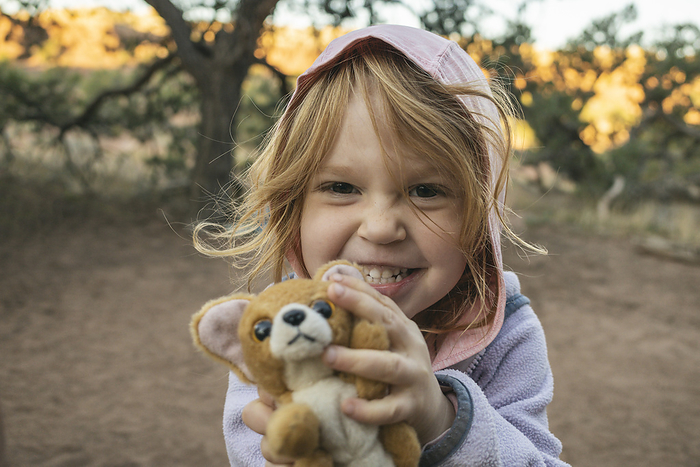 Young girl with toy in Canyonlands National Park, Utah