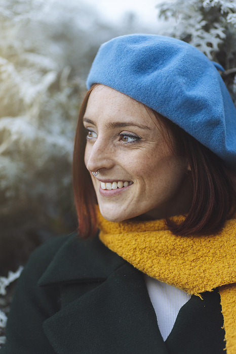 Happy redhead woman in blue beret and yellow scarf, Photo by Mikel Taboada