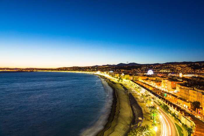 Night view of the Mediterranean coastline and the old town from the hill of the Castle Park in Nice, Côte d'Azur, France
