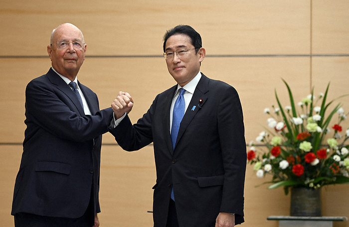 World Economic Forum President Schwab visits Japan Prime Minister Fumio Kishida touches arms with World Economic Forum President Klaus Schwab  left  before the meeting at the Prime Minister s Office at 11:51 a.m. on April 25, 2022.