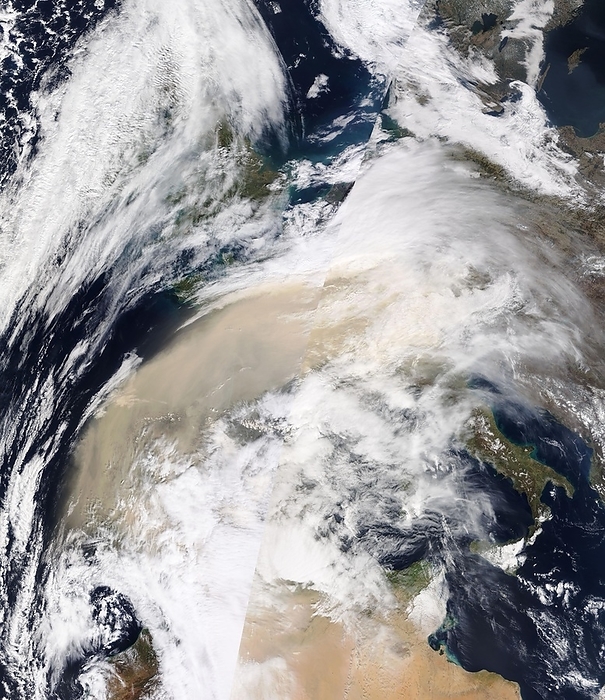 Saharan dust plume over western Europe, satellite image Satellite image of a plume of dust  orange, centre and left  from the Sahara Desert moving over western Europe towards the UK  top left  on 15th March 2022. The cloud of dust is two kilometres above ground level and is being carried on the strong winds of storm Celia. Image obtained by the Moderate Resolution Imaging Spectroradiometer  MODIS  sensor on NASA s Terra satellite., by NASA SCIENCE PHOTO LIBRARY