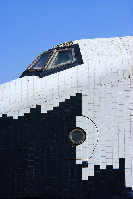 Russian space shuttle Buran The cabin section of the Russian space shuttle Buran at Baikonur space museum, Kazakhstan. Buran was very similar in appearance to the American space shuttle and used similar thermal protection tiles, visible in this image. The crew access hatch and flight deck windows are also visible., by MARK WILLIAMSON SCIENCE PHOTO LIBRARY