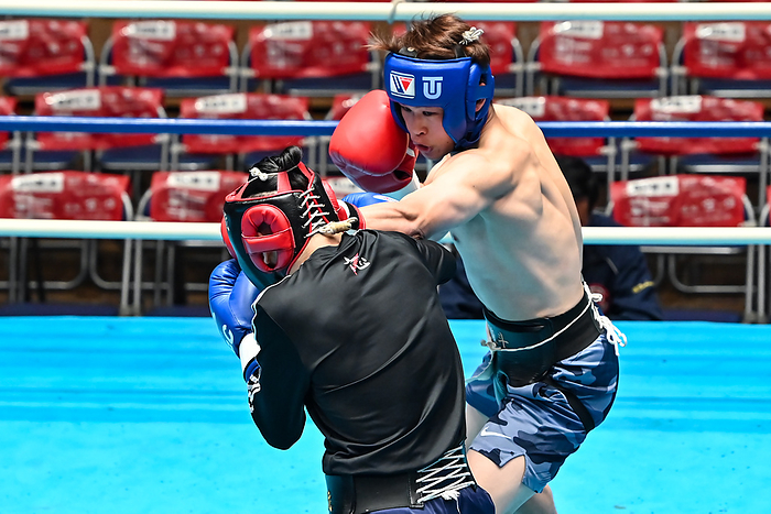 Boxing Hayato Tsutsumi pro test Hayato Tsutsumi  blue headgear  and Musashi Mori  red headgear  compete during their B class boxing pro test bout at Korakuen Hall in Tokyo, Japan, April 26, 2022.  Photo by Hiroaki Finito Yamaguchi AFLO 