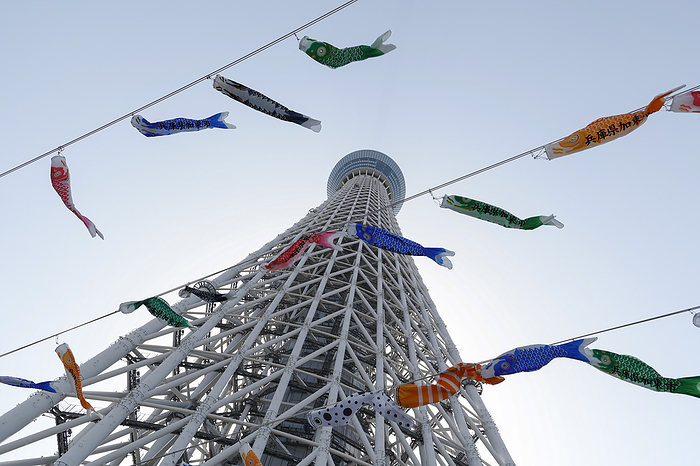 Golden Week holidays in Tokyo Koinobori  carp shaped windsocks or streamers  for celebrating Children s Day on display outside Tokyo Skytree on May 4, 2022, in Tokyo, Japan. Visitors wearing face masks gather to see the colorful carp shaped streamers during the Golden Week holidays. In Japan, Children s day is a national holiday celebrated on May 5.  Photo by Rodrigo Reyes Marin AFLO 