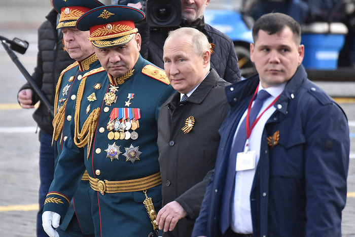 Military parade in Moscow on the 77th anniversary of the victory over Russia and Germany President Vladimir Putin  2nd from right  walks on Red Square with Russian Defense Minister Sergei Shoigu  3rd from right  in Moscow on May 9, 2022.
