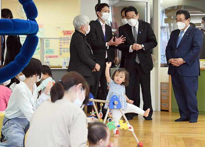Prime Minister Kishida Visits Child Rearing Exchange Salon Prime Minister Fumio Kishida  second from right  inspects a childcare exchange salon. On the far right is Minister of Health, Labor and Welfare Shigeyuki Goto at 9:00 a.m. on May 12, 2022 in Chuo ku, Tokyo.  Representative photo 