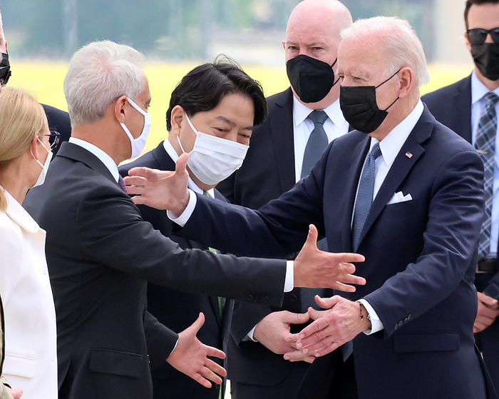United States President Joe Biden arrives at the Yokota Air Base in Tokyo May 22, 2022, Tokyo, Japan   United States President Joe Biden  R  shakes hands with U.S. ambassador to Japan Rahm Emanuel  L  while Japanese Foreign Minister Yoshimasa Hayashi  C  looks on upon his arrival at the Yokota Air Base in western Tokyo on Sunday, May 22, 2022. Biden will attend the QUAD meeting with leaders of India, Australia and Japan on May 24.    Photo by Yoshio Tsunoda AFLO  