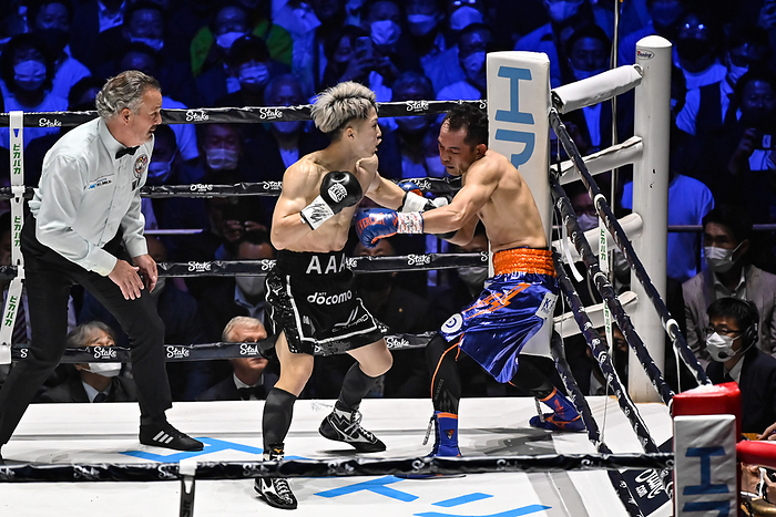 Naoya  Monster  Inoue v Nonito Donaire 2 Naoya Inoue  black gloves  of Japan and Nonito Donaire  blue gloves  of the Philippines compete during their bantamweight title unification boxing  Photo by Hiroaki Finito Yamaguchi AFLO  Naoya Inoue hits a match deciding left hook in the second round.