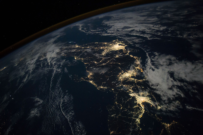 Japan at night, taken from the ISS  courtesy photo  Japan at Night  This photograph, taken by astronaut Randy  Komrade  Bresnik from the International Space Station  ISS , shows nighttime The lights are concentrated around three of the country s major cities: Tokyo  top cluster , Nagoya  middle , and Osaka  bottom .  The Greater Tokyo area, which is home to more than 30 million people, is the most populous metropolitan area in the world. However, Tokyo has a smaller energy consumption per capita compared to other megacities such as New York City. Renewable energy sources, such as solar power, are rapidly Overall, Japan was the fifth largest energy consumer in the world in 2019. Overall, Japan was the fifth largest energy consumer in the world in 2019.  Researchers have used nighttime imagery of lights to better understand human activity. The images can reveal population changes, urban development, The images can reveal population changes, urban development, energy use, economic activities, and changes in types of lighting.  The images can reveal population changes, urban development, energy use, economic activities, and changes in types of lighting. The contrast of the bright lights against the dark landscape is also beautiful. He shot it during ISS Expedition 52 53, his second excursion on the station.  While astronauts receive training on how to shoot photos from the space station, Bresnik s first photography lessons occurred long before From a young age, Bresnik learned to develop photographs in a dark room with his grandfather, who was a photographer for Amelia Earhart. His father was also a photographer, and Bresnik embraced photography and made a camera and lenses one of his first purchases when he got a job and had his own money. While living and working on the ISS, Bresnik shot several photographs of places on Earth that he could match with pictures he took of the locations on the ground. He promoted those pairs with  OneWorldManyViews on social media.  Learn more about astronaut photography in the Picturing Earth video series: part 1 Astronaut Photography in Focus  part 2 Window on the World  and part 3 Behind the Scenes.  Astronaut photograph ISS053 E 209380 was acquired on November 6, 2017, with a Nikon D4 digital camera using a 24 millimeter lens and is provided by the ISS The image was taken by a member of the Expedition 53 crew. The image has been cropped and enhanced to improve contrast, and lens artifacts have been removed. The image has been cropped and enhanced improved contrast and lens artifacts have been removed. Additional images taken by astronauts and cosmonauts can be viewed at the NASA JSC Gateway to Astronaut Photography of Earth. Caption by Kasha Patel.