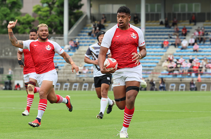 2022 Japan Rugby Charity Match June 11, 2022, Tokyo, Japan   Tonga Samurai XV lock Esei Haangana  R  carries the ball into the end zone to score a try while his teammate Lomano Lava Lemeki  L  celebrates at a charity match to raise fund for tsunami and volcano eruption suffered Kingdom of Tonga at the Prince Chichibu rugby stadium in Tokyo on Saturday, June 11, 2022. Emerging Blossoms defeated Tonga Samura XV 31 12.      Photo by Yoshio Tsunoda AFLO  