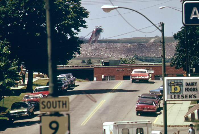 The Head of A Huge Coal Company Strip Mining Shovel Is Seen in the Background of This Picture of A Street In. 07 1974 Cadiz,  Harrison County, Ohio The Head of A Huge Coal Company Strip Mining Shovel Is Seen in the Background of This Picture of A Street In. 07 1974 Cadiz,  Harrison County, Ohio