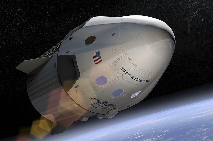 SpaceX s Crew Dragon in orbit, illustration SpaceX s Crew Dragon in orbit, illustration. SpaceX s Crew Dragon is a next generation spacecraft designed to carry astronauts to Earth orbit and beyond. The spacecraft will be capable of carrying up to seven crew. It will be able to land almost anywhere on Earth, and will be able to be rapidly refuelled and relaunched. It is intended to revolutionize access to space. SpaceX  Space Exploration Technologies  is a private US aerospace and space transport services company. It was founded in 2002 and has developed the Falcon rockets and the Dragon spacecraft. Future plans include crewed flights to Mars.  Credit: SPACEX   SCIENCE PHOTO LIBRARY