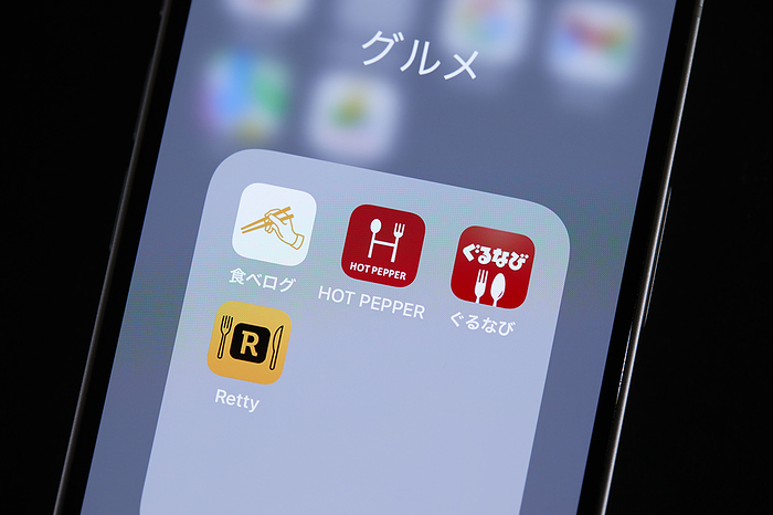 smartphone app The logos of mobile apps Tabelog, HOT PEPPER Gourmet, Gurunavi and Retty, are displayed on a screen in Tokyo, Japan, June 23, 2022.  Photo by AFLO 