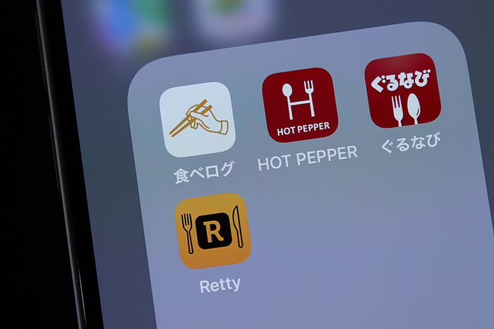 smartphone app The logos of mobile apps Tabelog, HOT PEPPER Gourmet, Gurunavi and Retty, are displayed on a screen in Tokyo, Japan, June 23, 2022.  Photo by AFLO 