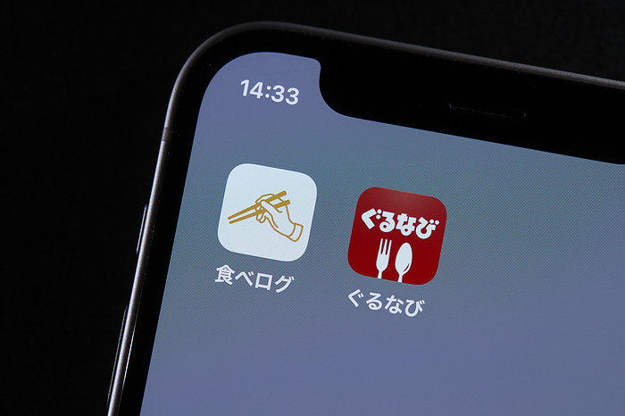 smartphone app The logos of mobile apps Tabelog and Gurunavi, are displayed on a screen in Tokyo, Japan, June 23, 2022.  Photo by AFLO 