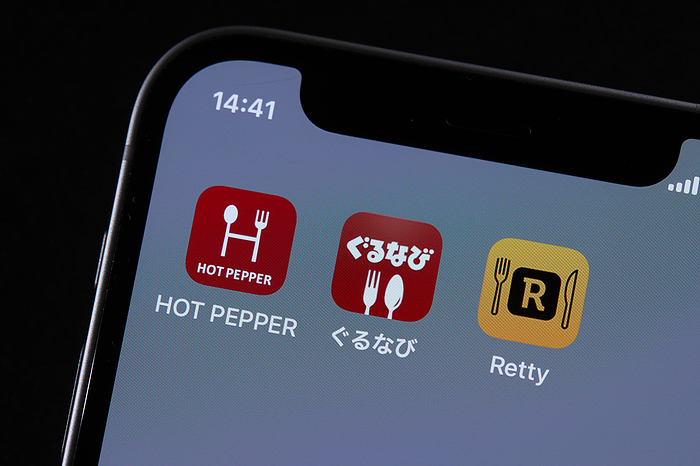 smartphone app The logos of mobile apps HOT PEPPER Gourmet, Gurunavi, and Retty, are displayed on a screen in Tokyo, Japan, June 23, 2022.  Photo by AFLO 