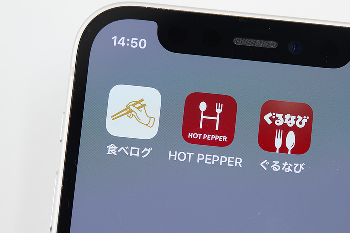 smartphone app The logos of mobile apps Tabelog, HOT PEPPER Gourmet, and Gurunavi, are displayed on a screen in Tokyo, Japan, June 23, 2022.  Photo by AFLO 