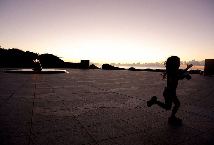 2022 Okinawa Memorial Day Children visit the  Cornerstone of Peace  in Mabuni early in the morning and excitedly wait for the sunrise in Itoman City, Okinawa Prefecture.