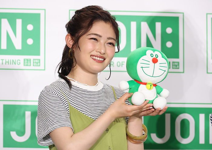 Uniqlo will start a sustainable campaign  JOIN: The Power of Clothing  June 29, 2022, Tokyo, Japan   Japanese actress Sakura Inoue poses for photo with a doll of Doraemon made of recycle plastic material as she attends fast fashion giant Uniqlo s sustainable campaign  JOIN: the Power of Clothing  in Tokyo on Wednessday, June 29, 2022. Uniqlo will start a global environmental campaign using recycle materials and they donate 1 million USD to Nippon Foundation to reduce marine debris.       Photo by Yoshio Tsunoda AFLO 