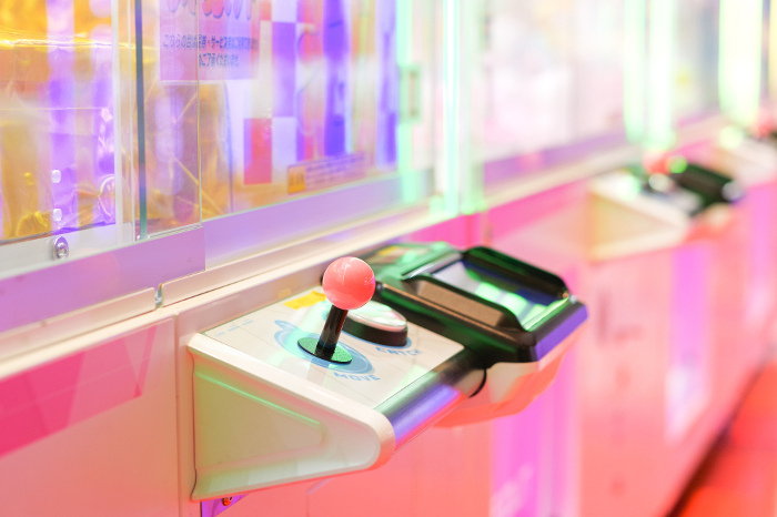 Crane game machines in game arcades