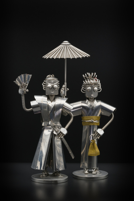 Samurai with a matching umbrella and woman in kimono, metal figurine