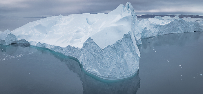 extreme icebergs from aerial view in panorama