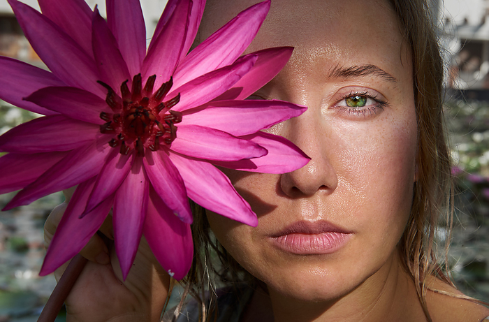 portrait of a girl with a flower on half of her face