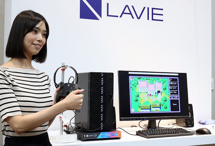 NEC brand re enters the gaming PC market July 5, 2022, Tokyo, Japan   A model displays Japan s personal computer maker NEC Personal Computer s new gaming PC  Lavie GX 750  at a presentation of NEC PC s new products in Tokyo on Tuesday, July 5, 2022. Lavie GX 750 is the 40th anniversary model of NEC PC s legendary PC9801, the most popular 16 bit PC and a total of 18.3 million units were shipped from 1982 thtough 2003.       Photo by Yoshio Tsunoda AFLO  