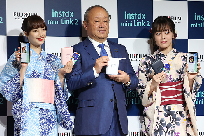 Cheki  for smartphone printer Fujifilm announced July 7, 2022, Tokyo, Japan   Japan s Fujifilm president Teiichi Goto  C  poses with actresses Suzu Hirose  L  and Rikka Ihara  R  as they attend a presentation of Fujifilm s new smartphone printer  instax mini Link 2  which enables to make card sized instant photos in Tokyo on Thursday, July 7, 2022. The new  instax mini  can make prints with various digital effects in the air as an augumented reality  AR  effects.       Photo by Yoshio Tsunoda AFLO  