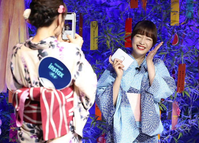 Cheki  for smartphone printer Fujifilm announced July 7, 2022, Tokyo, Japan   Japanese actress Suzu Hirose  R  smiles as another actress Rikka Ihara  L  takes her pictures with a smartphone as they attend a presentation of Fujifilm s new smartphone printer  instax mini Link 2  which enables to make card sized instant photos in Tokyo on Thursday, July 7, 2022. The new  instax mini  can make prints with various digital effects in the air as an augumented reality  AR  effects.       Photo by Yoshio Tsunoda AFLO  