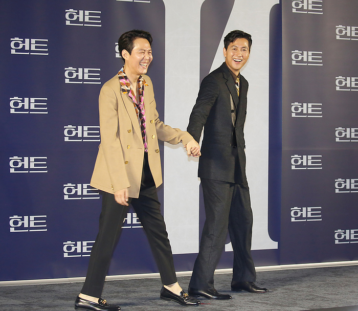 Production press conference for the movie  Hunt  in Seoul  L R  Lee Jung Jae and Jung Woo Sung, July 5, 2022 : A South Korean actor and director Lee Jung Jae and actor Jung Woo Sung joke as they pose for photographers at a production press conference for the movie  Hunt  in Seoul, South Korea.  Photo by Lee Jae Won AFLO   SOUTH KOREA 
