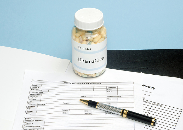 Obamacare prescription, conceptual image ObamaCare prescription bottle with insurance verification form., by SHERRY YATES YOUNG SCIENCE PHOTO LIBRARY