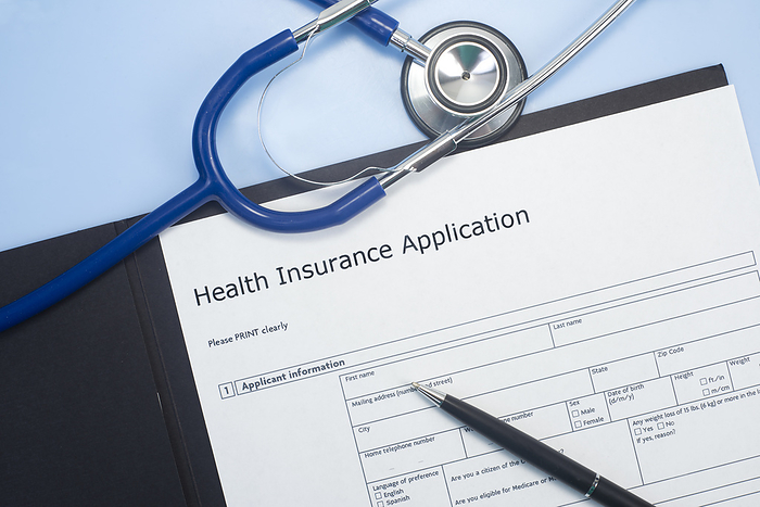 Health insurance application Application for health insurance with stethoscope., by SHERRY YATES YOUNG SCIENCE PHOTO LIBRARY