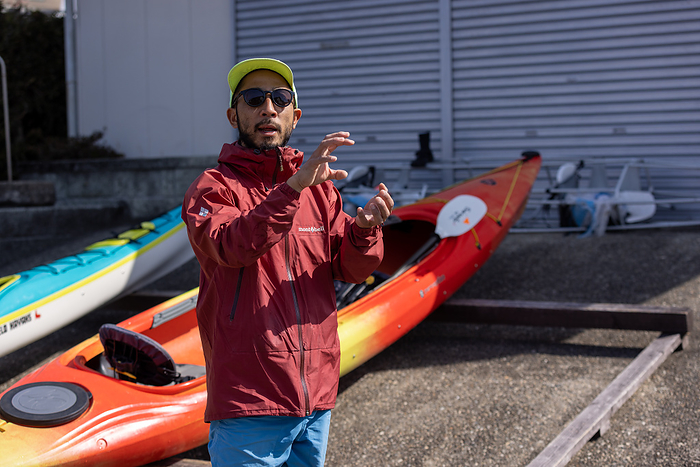 Japanese man working at a sea kayak store Kohei Maruo, a native of Minami Ise Town, Mie Prefecture, and a native of Kanagawa Prefecture, is working at Sunnyside Kayaks, a sea kayak store, as a Community Development Cooperation Volunteer after traveling the world.  Photo taken March 2022 