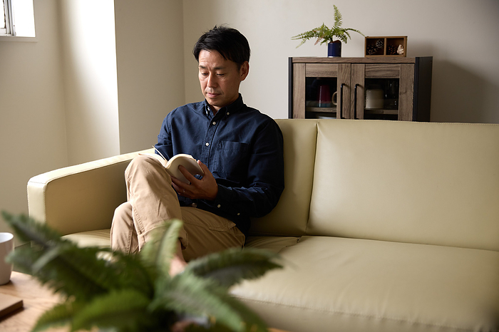Japanese man reading a book
